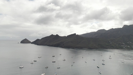 Aerial drone video of sail boats anchored in the bay Taiohae, Nuku Hiva, marquesas islands, 2K7