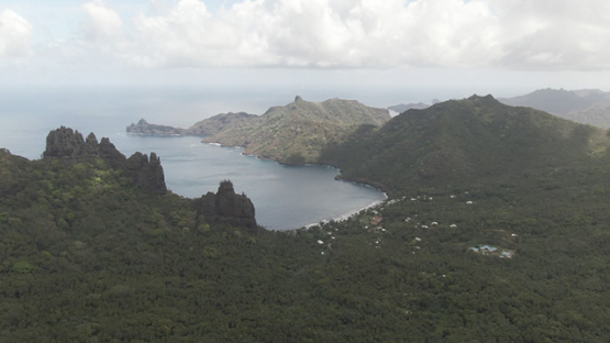 Aerial drone video, Nuku Hiva, valley and bay of Hatiheu, rocky mountains, marquesas islands, 2K7