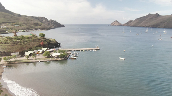 Aerial drone video of Nuku Hiva, pier of Taiohae bay, marquesas islands, 2K7