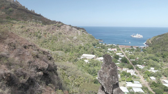 Fatu Hiva, aerial drone view of villlage Omoa, cargo ship in the bay, marquesas islands, 2K7