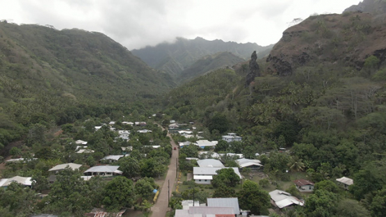 Fatu Hiva, aerial drone view of villlage Omoa and mountains surrounding, marquesas islands, 2K7