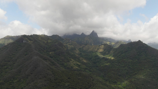 Ua Pou, Aerial drone view of peaks and mountains in clouds, Marquesas islands, Polynesia, 2K7