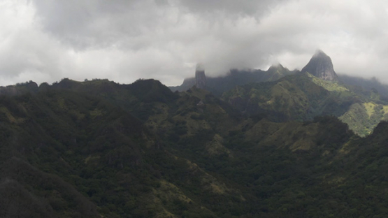 Ua Pou, Aerial drone view of peaks and mountains in clouds, Marquesas islands, Polynesia, 2K7