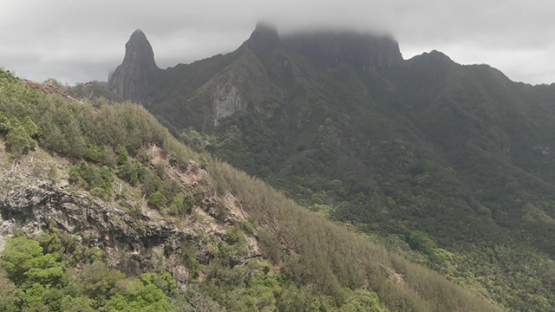 Aerial drone view of Ua Pou, Pillars and mountains peaks under clouds, Marquesas islands, Polynesia, 2K7