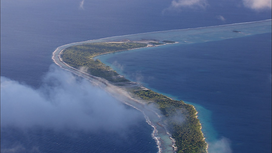Aerial view of an atoll and barrier reef, Tuamotu, French Polynesia