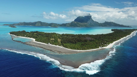 Aerial view of the island Bora Bora and the lagoon, drone shot 4K UHD
