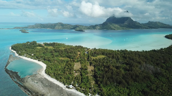 Aerial view of the island Bora Bora and the lagoon, drone shot 4K UHD