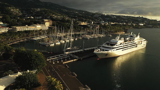 Aerial view of cruise ship and sail boats in the harbour, Tahiti 4K UHD