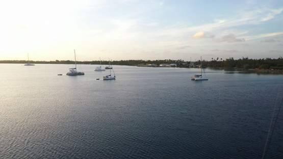 Fakarava, aerial view of Sail boats anchored in the lagoon, 4K UHD