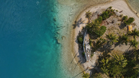 Rangiroa, aerial view of a wreck of sail boat on the beach, 4K UHD