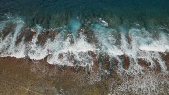 Bora Bora, aerial view of the barrier reef and shore break, 4K UHD