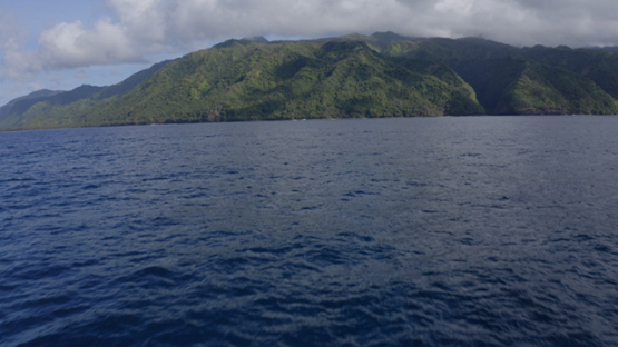 Tahiti, aerial view of Te Pari, lagoon and mountains, 4K UHD