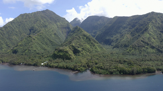 Tahiti, aerial view of Te Pari, along the coast, lagoon and mountains, 4K UHD