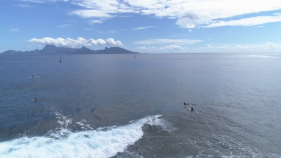 Aerial view of surfer in the pass Taapuna, 4K UHD