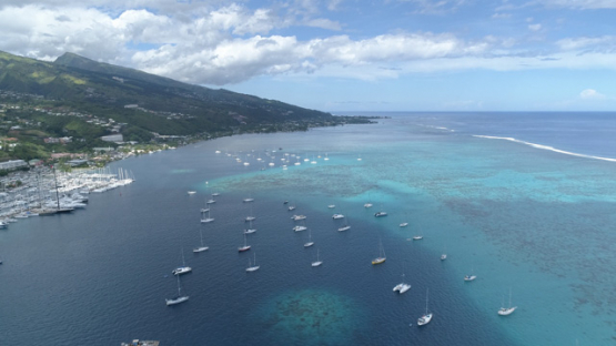 Aerial view of Tahiti, anchored sail boats and Marina Taina, 4K UHD