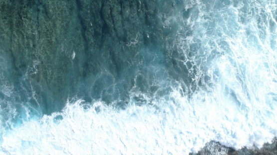 Tahiti, aerial verttical view of the waves on the barrier reef, Paea, 4K UHD