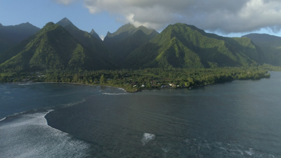 Tahiti, aerial view of the pass and wave Teahupoo and mountains, 4K UHD
