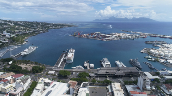Tahiti, aerial drone shot of the town and harbour of Papeete, 4K UHD