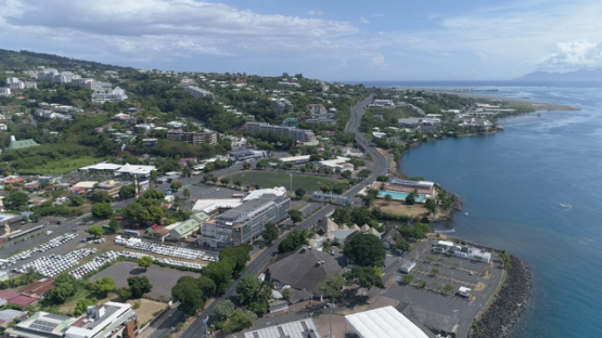Tahiti, aerial drone shot of the town Papeete and avenue, 4K UHD