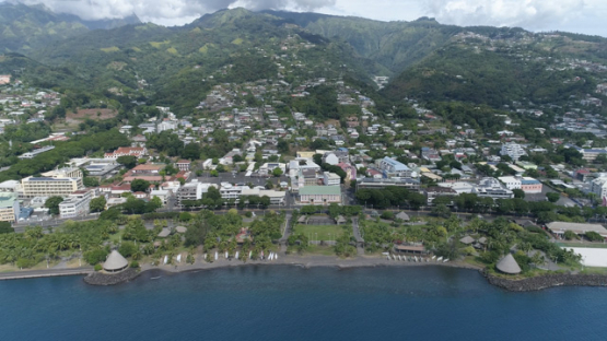 Tahiti, aerial drone shot of the seafront of Papeete and sqare, 4K UHD