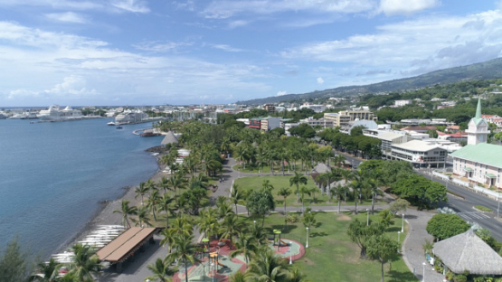 Tahiti, aerial drone shot of the town Papeete above Paofai Park, 4K UHD
