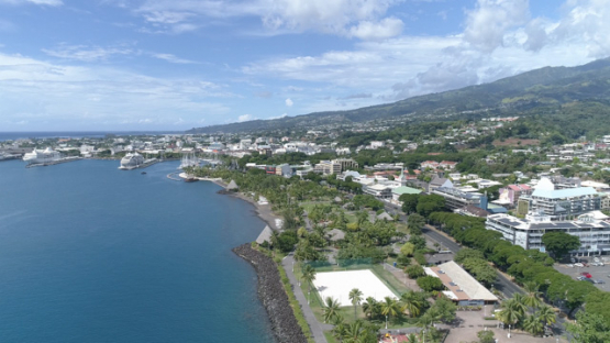Tahiti, aerial drone shot of the town Papeete and Paofai Park, 4K UHD