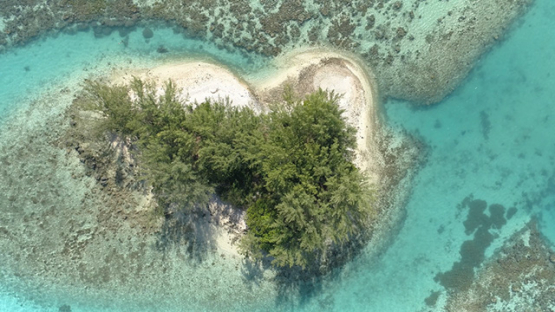 Moorea, aerial view of islet in the lagoon, 4K UHD