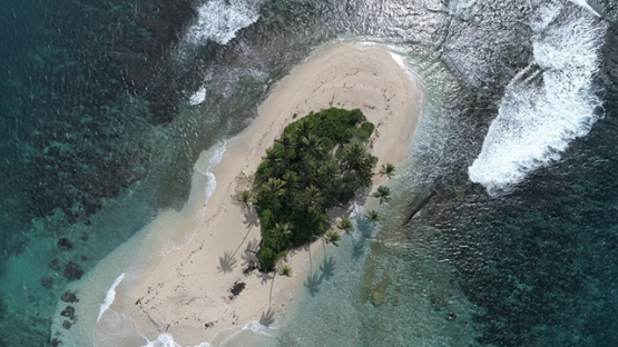 Peninsula of Tahiti, Aerial view above an islet in the lagoon of Taravao, 4K UHD