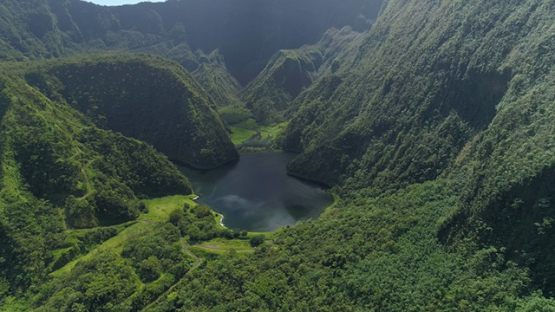 Tahiti, aerial view of the lake Vaihiria in the middle of the mountains, 4K UHD