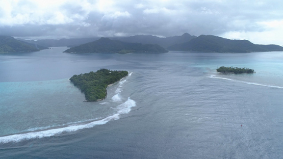 Tahaa, aerial view of the pass and motu Toahotu, island and lagoon, 4K UHD