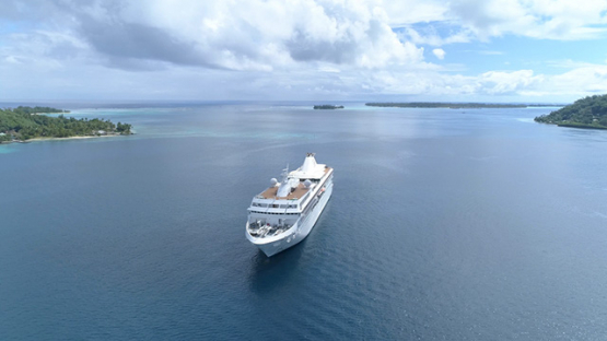 Bora Bora, aerial view of cruise ship anchored in the lagoon, 4K UHD