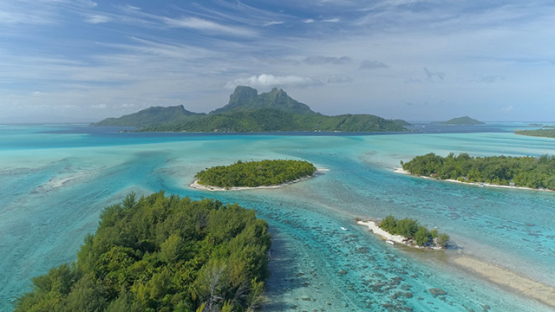 Bora Bora, aerial view of the island and islet in the lagoon, 4K UHD