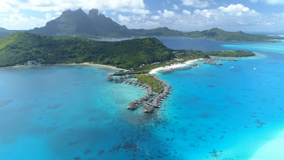 Bora Bora island, aerial view of a luxury hotel in the lagoon, 4K UHD