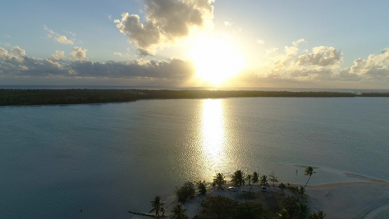Maupiti, aerial view of sunset on the lagoon, 4K UHD