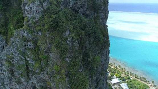 Maupiti, aerial view of the Teurafaatiu mountain and the lagoon, 4K UHD