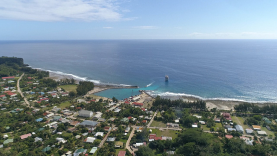 Rurutu, aerial view of the village Moerai and cargo ship, 4K UHD