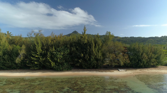 Tubuai, aerial view of the beach of Mata Ura and hills, 4K UHD