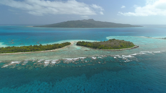 Tubuai, aerial view of the islet Motu Roa behind the barrier reef, 4K UHD