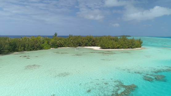 Tubuai, aerial view of the islet Motu Roa and barrier reef, 4K UHD