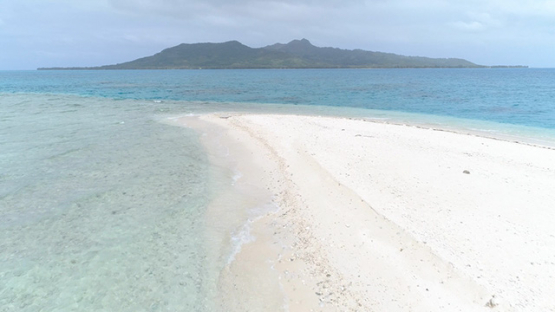 Tubuai, aerial view of the islet Motu Rautaro and the island, 4K UHD