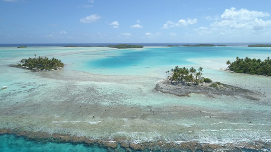 Rangiroa, aerial view of the blue lagoon, islets and barrier reef, 4K UHD