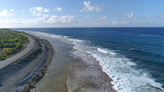 Rangiroa, aerial view of the exit of Tiputa pass and the reef, 4K UHD