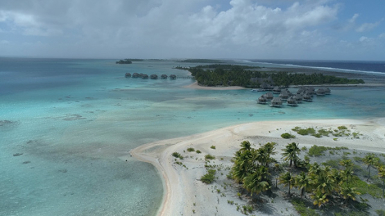Tikehau, aerial view of a luxury overwater hotel on the barrier reef, 4K UHD