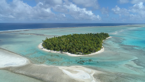 Tikehau, aerial view of the islet Motu Tavararo and barrier reef, 4K UHD