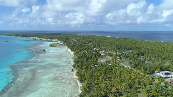 Tikehau, aerial view of the village and lagoon, 4K UHD
