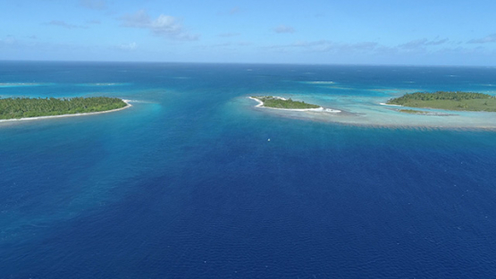 Tikehau, aerial view of the pass Tuheiava and barrier reef, 4K UHD