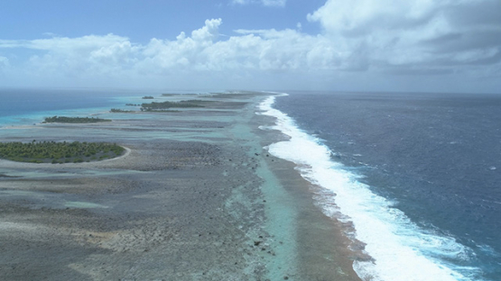 Tikehau, aerial view of the shore of barrier reef and islets, 4K UHD
