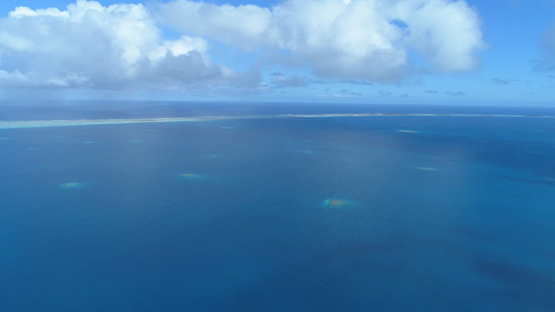 Tikehau, aerial view of the lagoon and barrier reef, 4K UHD