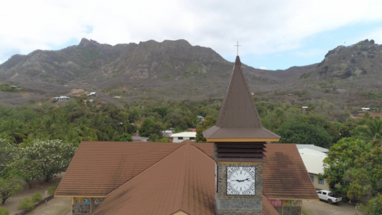 Ua Pou, aerial view of the church of the village Hakahau, 4K UHD