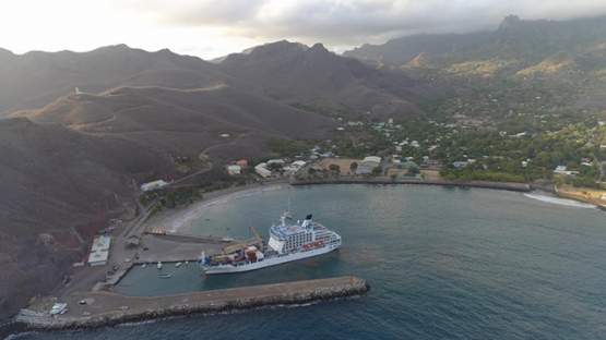 Ua Pou, aerial view of cargo ship docking in Hakahau bay, 4K UHD